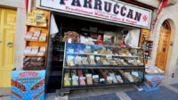 A sweet shop with a sign reading "Parruccan" and a display of traditional Maltese sweets in a colorful array.