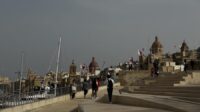 Approaching Birgu on a grey weather day, with flags flying all over the town