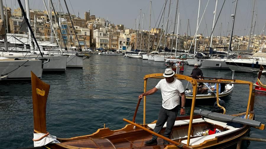 A traditional Maltese water taxi waiting to leave Birgu Marina