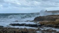 Bahar ic Caghaq shoreline on a colder, moody weather day with waves.