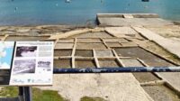 Salt pans and a touristic attraction plaque describing them